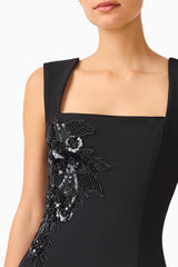 Brunette model wears the Odelia Beaded Mini Dress in Black detail shot