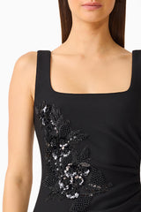Brunette model wearing the Odelia Beaded Maxi Dress in Black detail shot