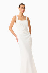 Brunette model wearing the Odelia Beaded Maxi Dress in White close up hand on hip shot