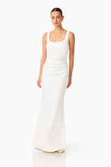 Brunette model wearing the Odelia Beaded Maxi Dress in White posed shot