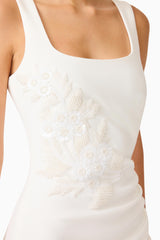 Brunette model wearing the Odelia Beaded Maxi Dress in White detail shot