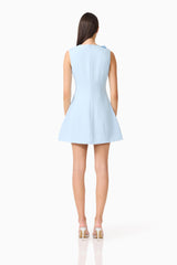 Brunette model wearing the Reina Applique Mini Dress in Sky Blue back shot
