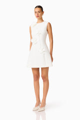 Brunette model wearing the Reina Applique Mini Dress Dress White side shot