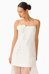 Brunette model wearing the Reina Appliqué Gown in White close up shot