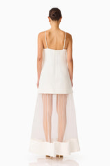 Brunette model wearing the Reina Appliqué Gown in White back shot