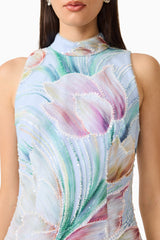 Brunette model wearing the Priselle High Neck Mini Dress in Blue Floral close up shot