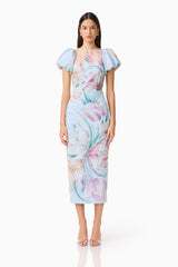 Brunette model wears the Priselle Puff Sleeve Midi Dress in Blue Floral front shot