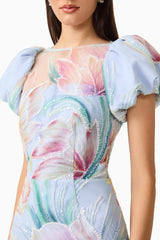 Brunette model wears the Priselle Puff Sleeve Midi Dress in Blue Floral detail shot
