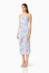 Brunette model wearing the Priselle Strapless Midi Dress in Blue Floral side shot
