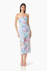 Brunette model wearing the Priselle Strapless Midi Dress in Blue Floral hands on hip shot
