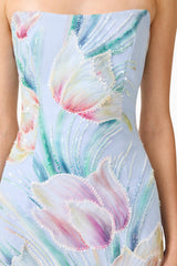 Brunette model wearing the Priselle Strapless Midi Dress in Blue Floral detail shot