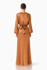 Brunette model wearing the Kai Long Sleeve Maxi Dress in Brown back shot 