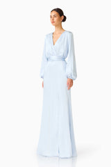 Brunette model wearing the Kai Long Sleeve Maxi Dress in Pale Blue side shot 