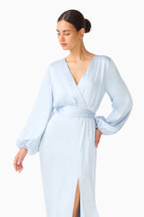 Brunette model wearing the Kai Long Sleeve Maxi Dress in Pale Blue close up shot 