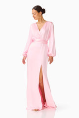 Brunette model wearing the Kai Long Sleeve Maxi Dress in Pale Pink posed looking away shot 