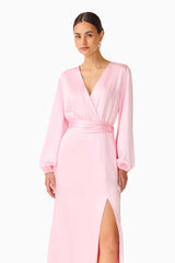 Brunette model wearing the Kai Long Sleeve Maxi Dress in Pale Pink close up shot 