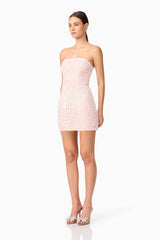 Brunette model wearing Kiki Strapless Mini Dress in Pink side shot