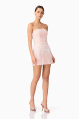 Brunette model wearing Kiki Strapless Mini Dress in Pink posed shot
