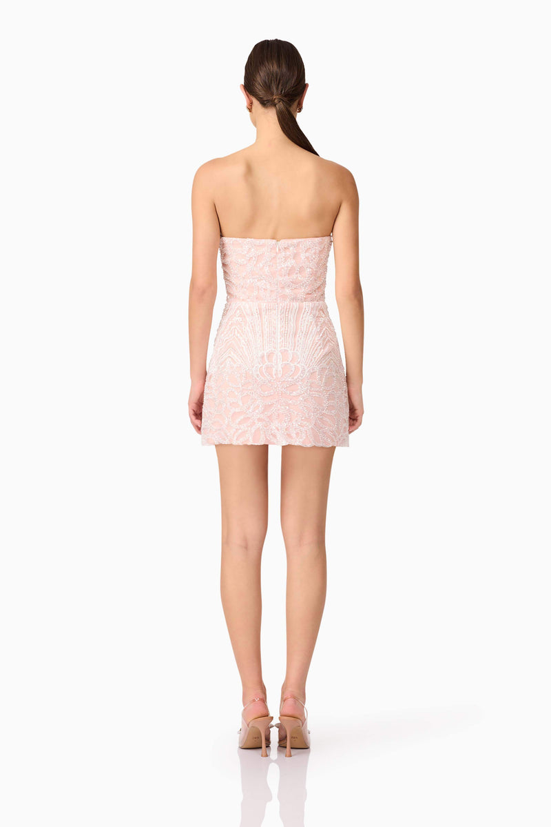 Brunette model wearing Kiki Strapless Mini Dress in Pink back shot