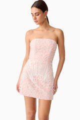 Brunette model wearing Kiki Strapless Mini Dress in Pink close up posed shot