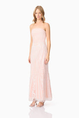 Blonde model wearing Kiki Strapless Gown in Pink side shot