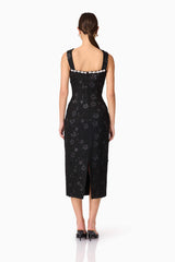 Brunette model wearing Ellouise Embellished Tweed Midi Dress in Black back shot