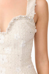 Blonde model wearing Ellouise Embellished Tweed Midi Dress in White detail shot