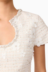 Brunette model wearing Ellouise Embellished Tweed Set in White top detail shot