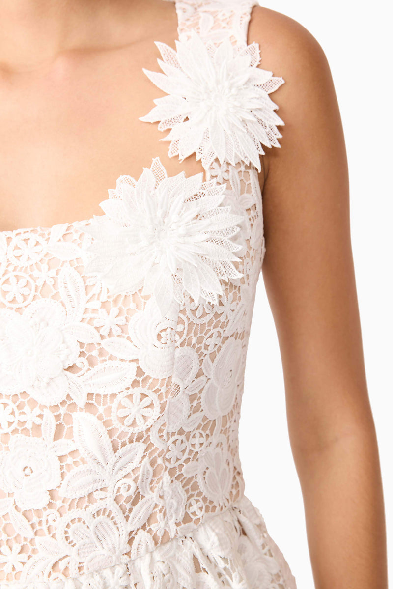 Brunette model wearing Margot Floral Mini Dress in White detail shot