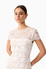 Brunette model wearing Margot Lace Maxi Dress in White close up shot