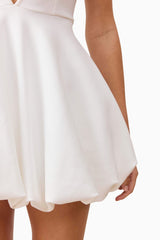 Blonde model wearing Fiona Halter Mini Dress in White detail shot