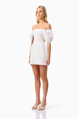 Blonde model wearing Fiona Off The Shoulder Mini Dress in White side shot