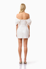 Blonde model wearing Fiona Off The Shoulder Mini Dress in White back shot