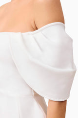 Blonde model wearing Fiona Off The Shoulder Mini Dress in White detail shot