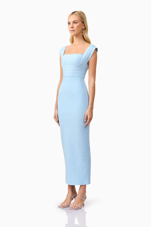 Blonde model wearing Fiona Fitted Maxi Dress in Blue side shot