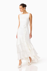 Erielle Tiered Gown in White with tiered skirt and floral belt posed shot