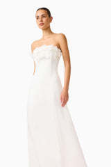Espera Applique Gown in White with floral applique along the bust close up walking shot