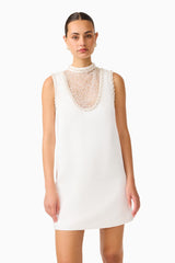 Espera Shift Mini Dress in White with collared neckline & front sheer pearl panel close up shot