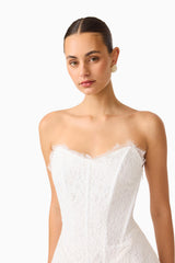 Clarisse Tulip Mini Dress in White with corset bodice & lace trim close up shot
