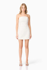 Blonde model wearing Lola Strapless Mini Dress in White front shot