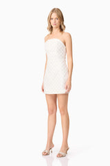 Blonde model wearing Lola Strapless Mini Dress in White side shot