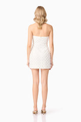 Blonde model wearing Lola Strapless Mini Dress in White back shot