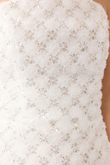 Blonde model wearing Lola Strapless Mini Dress in White detail shot