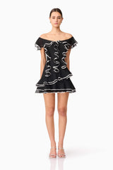 Brunette model wearing Melissa Tiered Mini Dress in Black front shot
