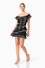Brunette model wearing Melissa Tiered Mini Dress in Black posed shot