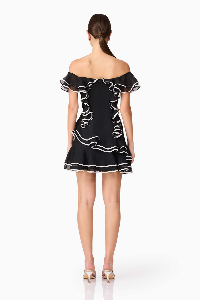 Brunette model wearing Melissa Tiered Mini Dress in Black back shot