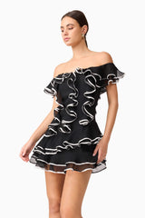 Brunette model wearing Tiered Mini Dress in Black closed shot