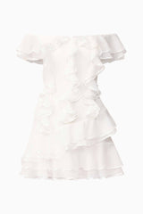 Blonde model wearing Melissa Tiered Mini Dress in White ghost shot