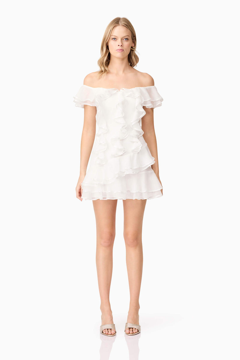 Blonde model wearing Melissa Tiered Mini Dress in White front shot