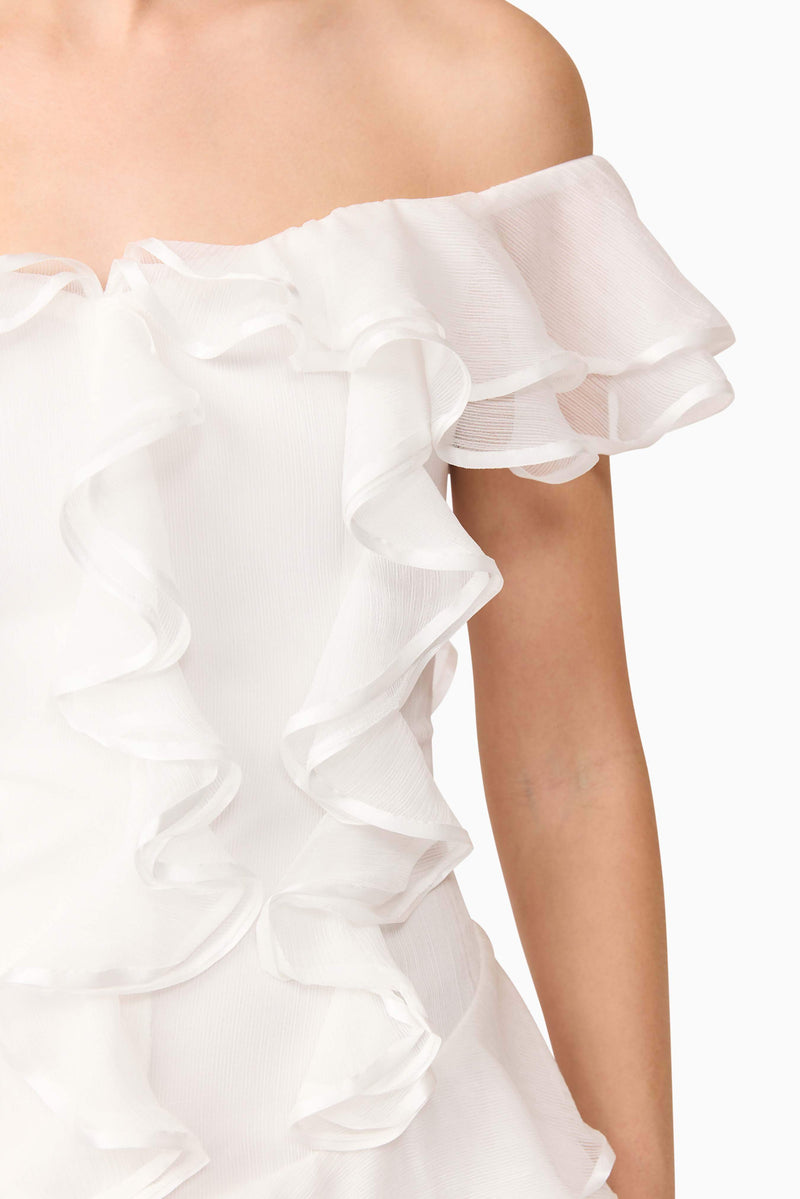 Blonde model wearing Melissa Tiered Mini Dress in White detail shot